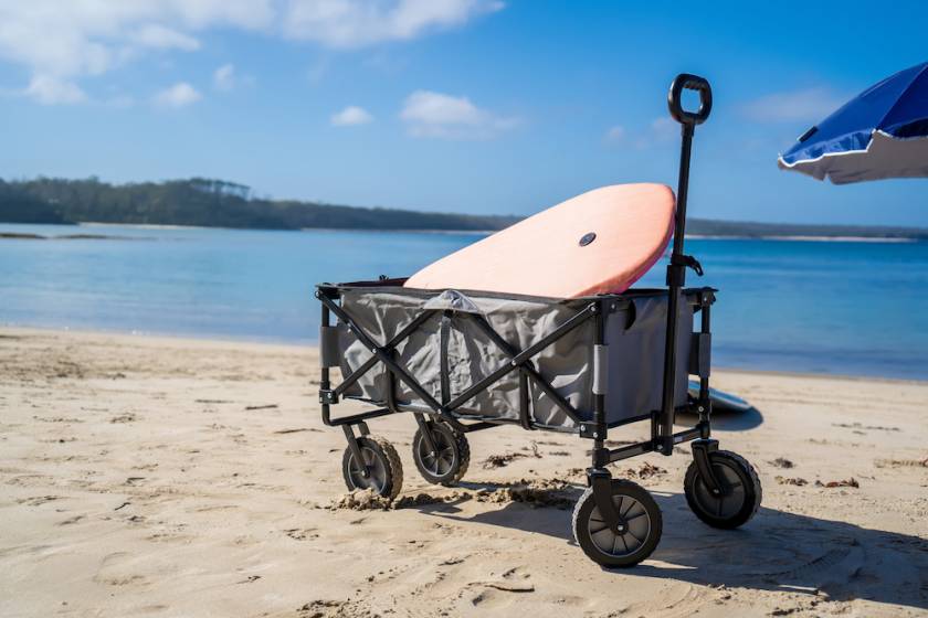 beach wagon with boogie board in it and umbrella just out of frame